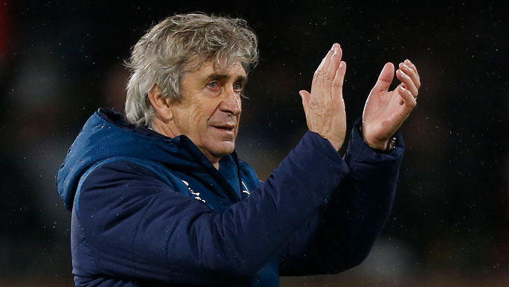 Manuel Pellegrini applauds the Claret and Blue Army