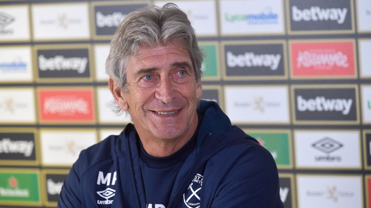 Manuel Pellegrini smiles during his pre-Everton press conference