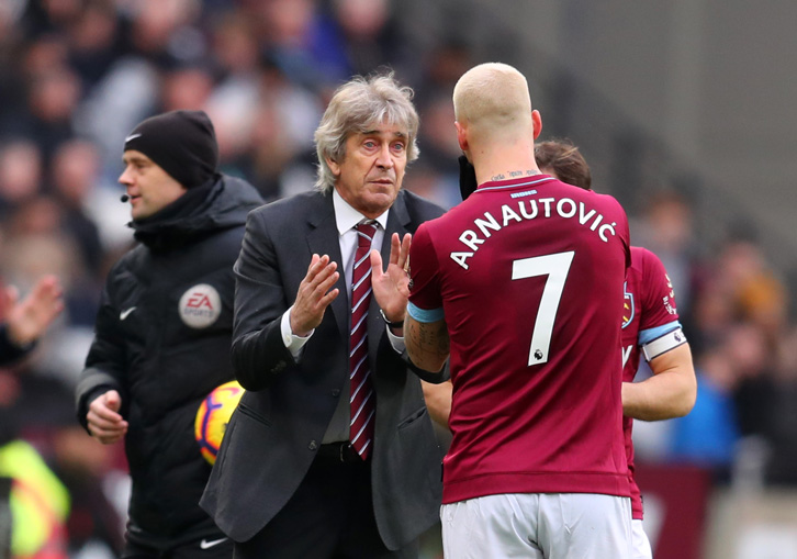 Manuel Pellegrini gives Marko Arnautovic instructions on the touchline