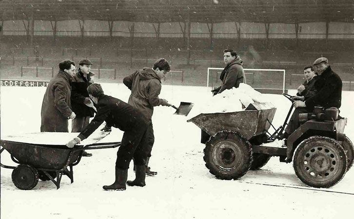 Groundstaff clear snow from the Boleyn Ground pitch in 1963