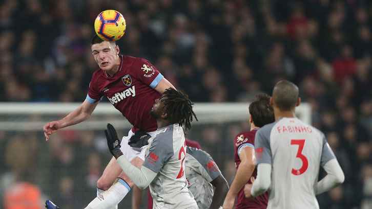 Declan Rice wins a header above Divock Origi