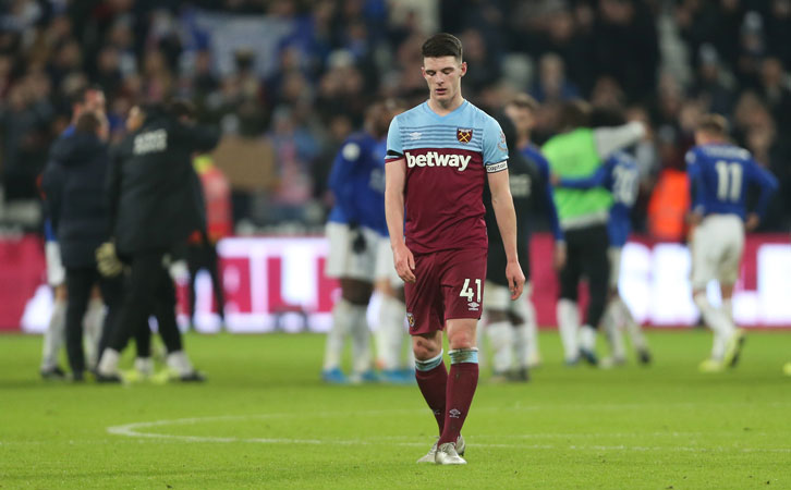 A dejected Declan Rice leaves the pitch following Saturday's defeat by Leicester City