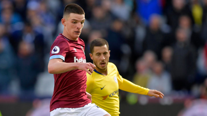 Declan Rice holds of Chelsea's Eden Hazard