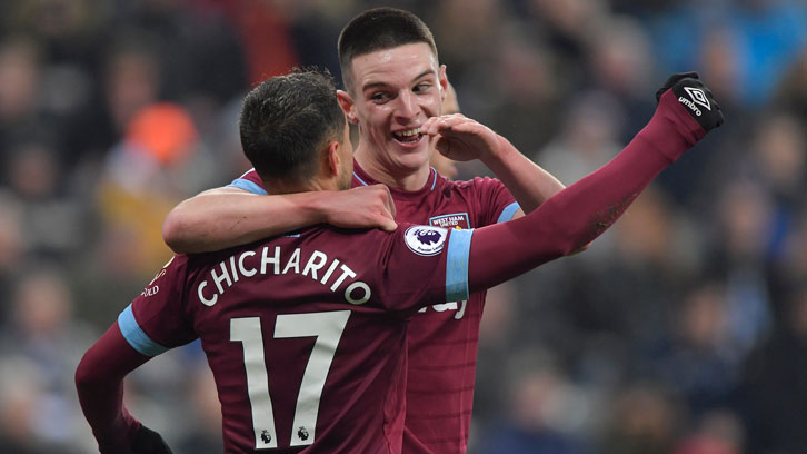 Declan Rice celebrates with Chicharito at St James' Park