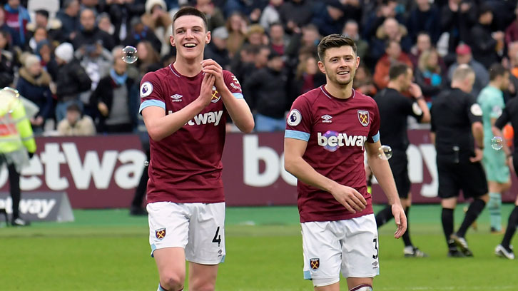 Declan Rice and Aaron Cresswell applaud the Claret and Blue Army