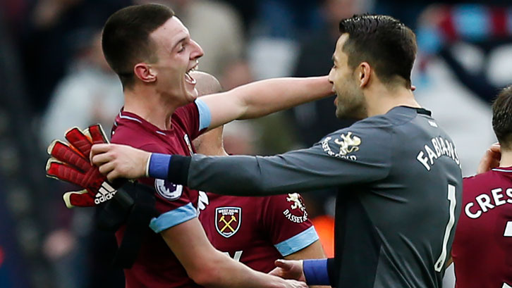 Declan Rice and Lukasz Fabianski embrace