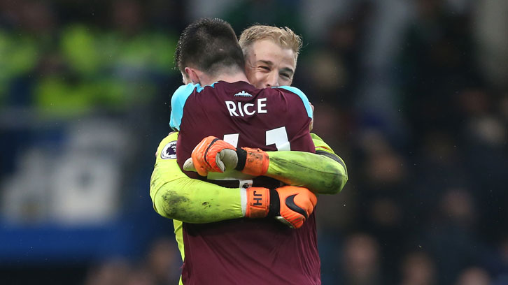 Declan Rice and Joe Hart celebrate a hard-earned point at Chelsea