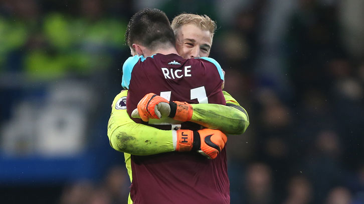 Declan Rice and Joe Hart celebrate a hard-earned point at Chelsea