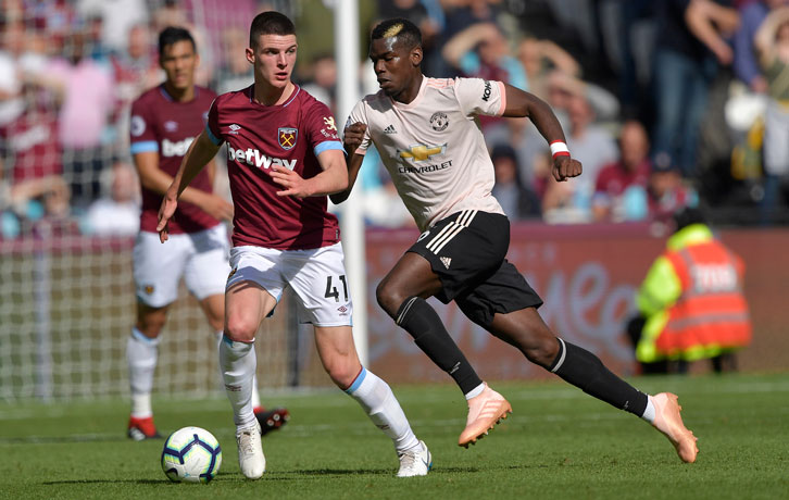 Declan Rice holds off Manchester United's Paul Pogba