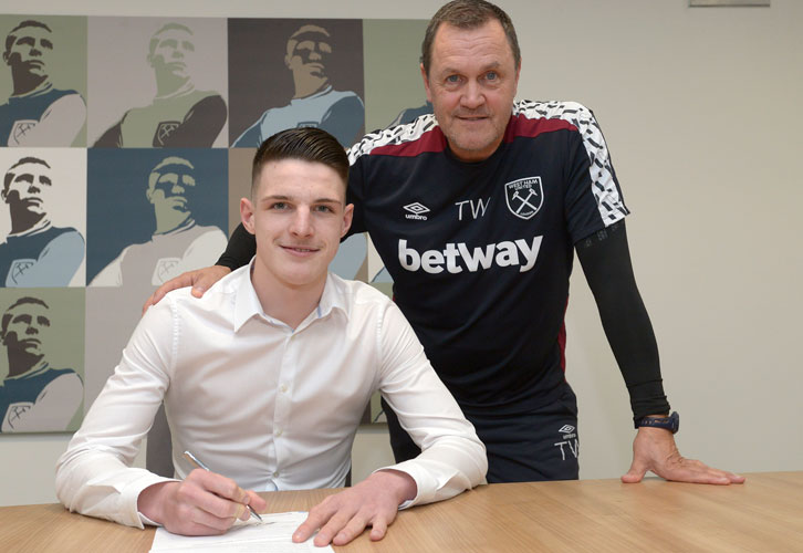 Academy Director Terry Westley watches Declan Rice sign a new long-term contract in March 2017