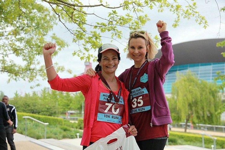 Roberta Moore celebrates finishing the Fun Run