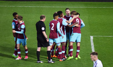 Samuelsen is mobbed after scoring a brilliant fourth on Monday