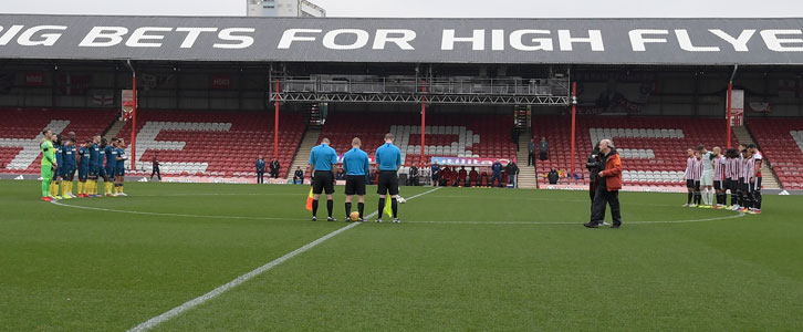 A minute's silence was held in memory of Brentford technical director Robert Rowan