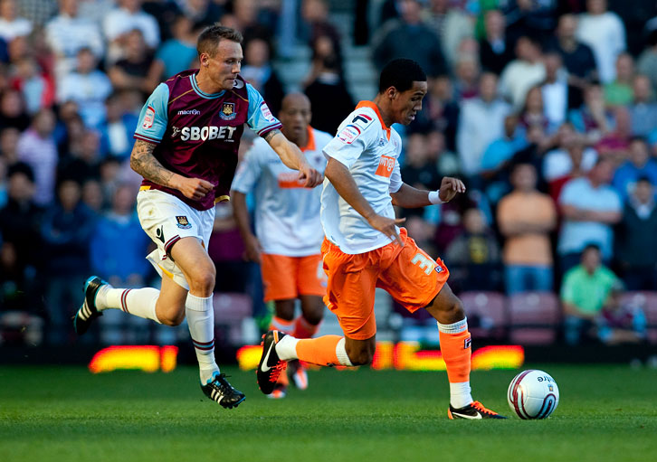 Matt Taylor runs with the ball