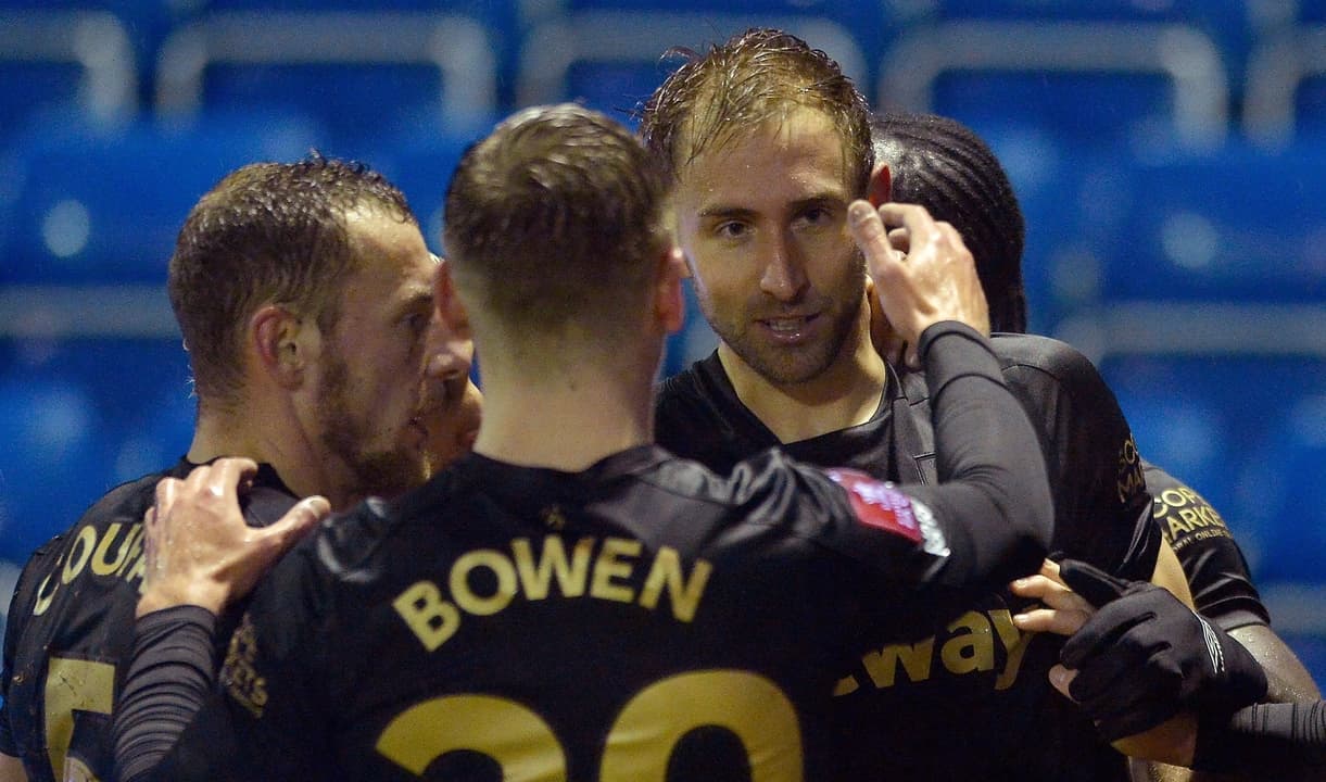 The Hammers celebrate Craig Dawson's goal at Stockport