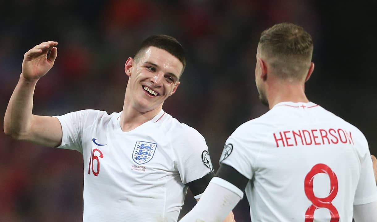 Declan Rice congratulates Jordan Henderson while playing for England