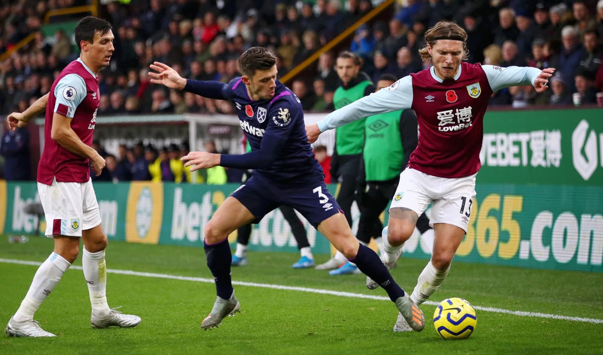 Aaron Cresswell challenges Jeff Hendrick