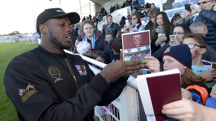 Michail Antonio signs autographs at a West Ham United Ladies fixture