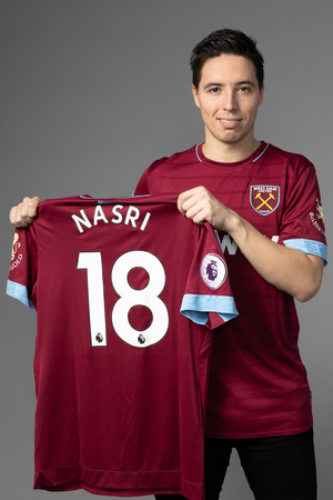 Nasri poses with his shirt