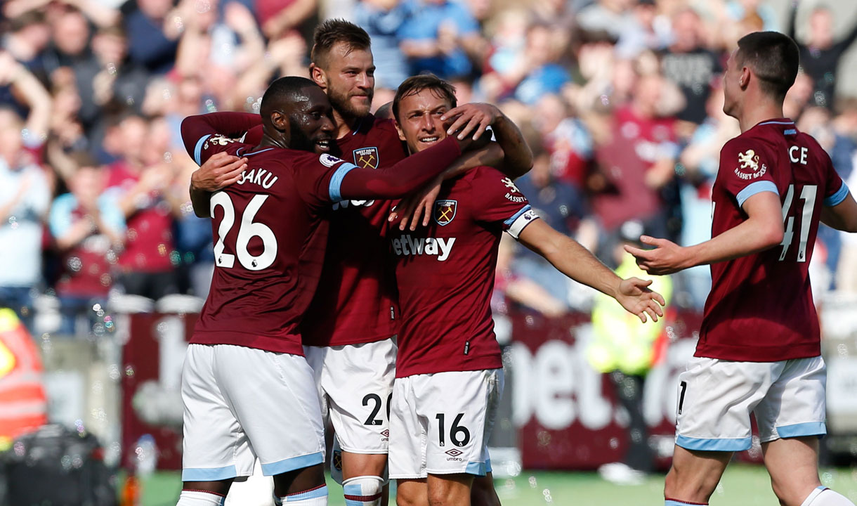 West Ham's players celebrate scoring against Manchester United at London Stadium