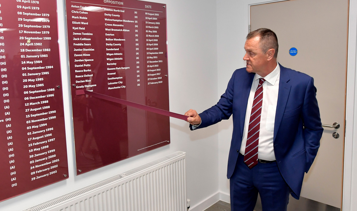 Terry Westley reveals Ben Johnson's name on an honours board at Chadwell Heath