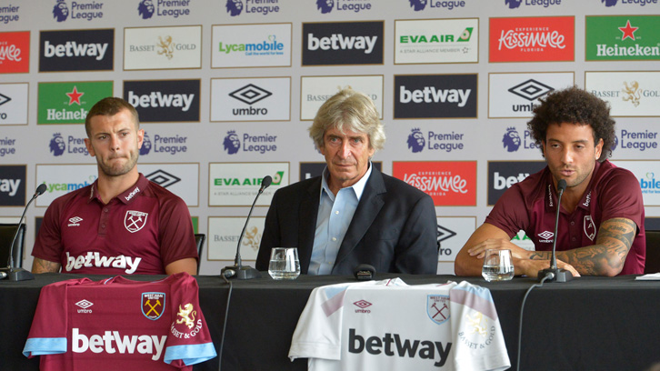 Manuel Pellegrini flanked by Jack Wilshere and Felipe Anderson at London Stadium on Tuesday