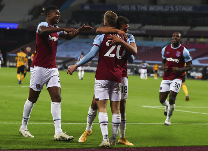 West Ham players celebrate scoring against Wolves