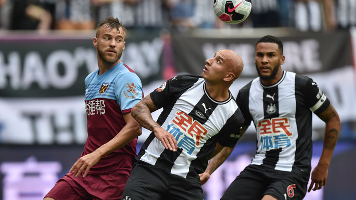 Andriy Yarmolenko challenges Jonjo Shelvey for possession in Shanghai