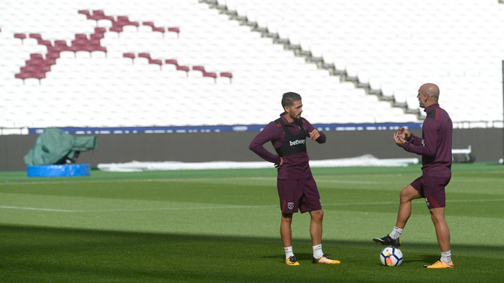 Pablo Zabaleta and Manuel Lanzini chat during a training session at London Stadium