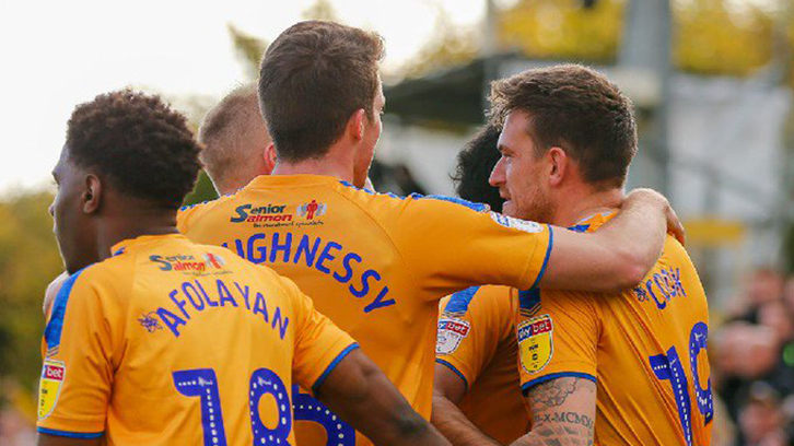 Oladapo Afolayan celebrates Mansfield Town's draw