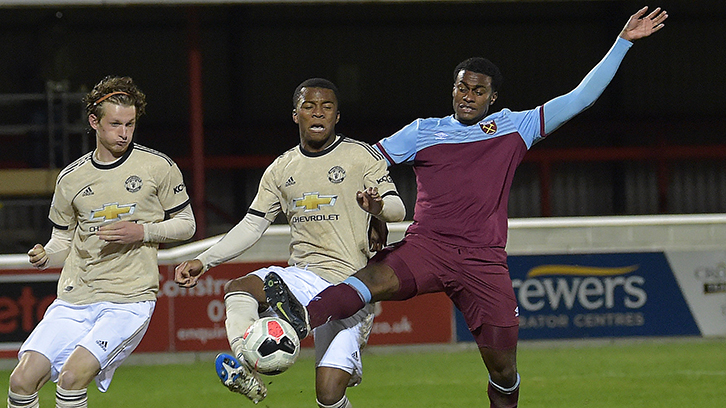 Olatunji Akinola challenges for a loose ball against Manchester United U23s