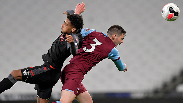 Gonçalo Cardoso heads the ball clear for West Ham U23s