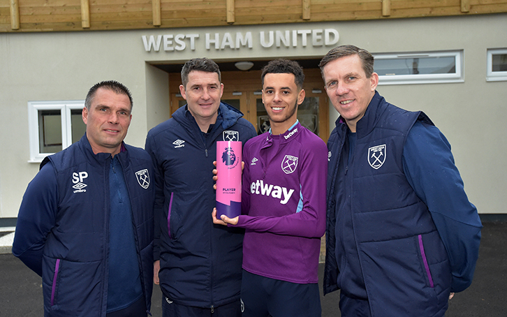 Steve Potts, Dmitri Halajko and Academy Manager Ricky Martin present Nathan Holland with his PL2 Player of the Month award