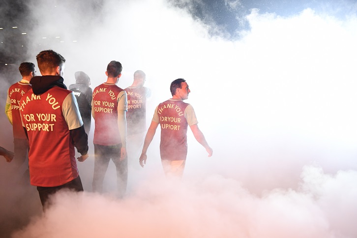 Players emerge from the smoke