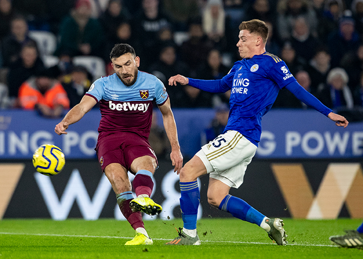 Robert Snodgrass gets a shot away against Leicester City