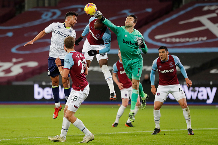 Lukasz Fabianski punches the ball clear