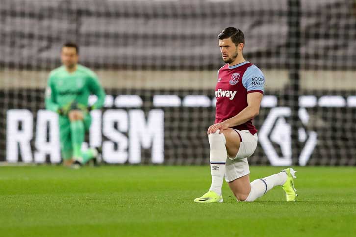 Aaron Cresswell takes the knee last season