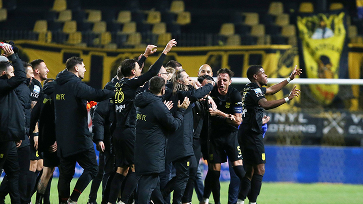 Xande Silva (far right) celebrates Aris FC's derby win