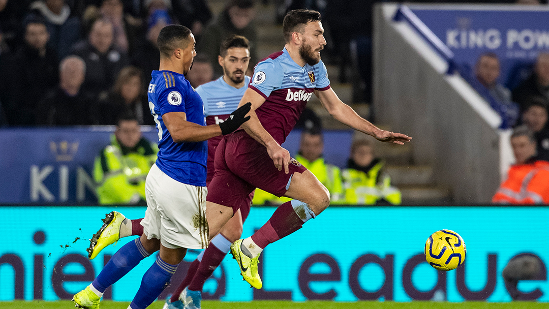 Robert Snodgrass vies for the ball against Leicester City