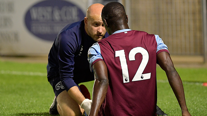 Head of Academy Science and Medicine Tom Smith treating a player during a game on 23 August 2019
